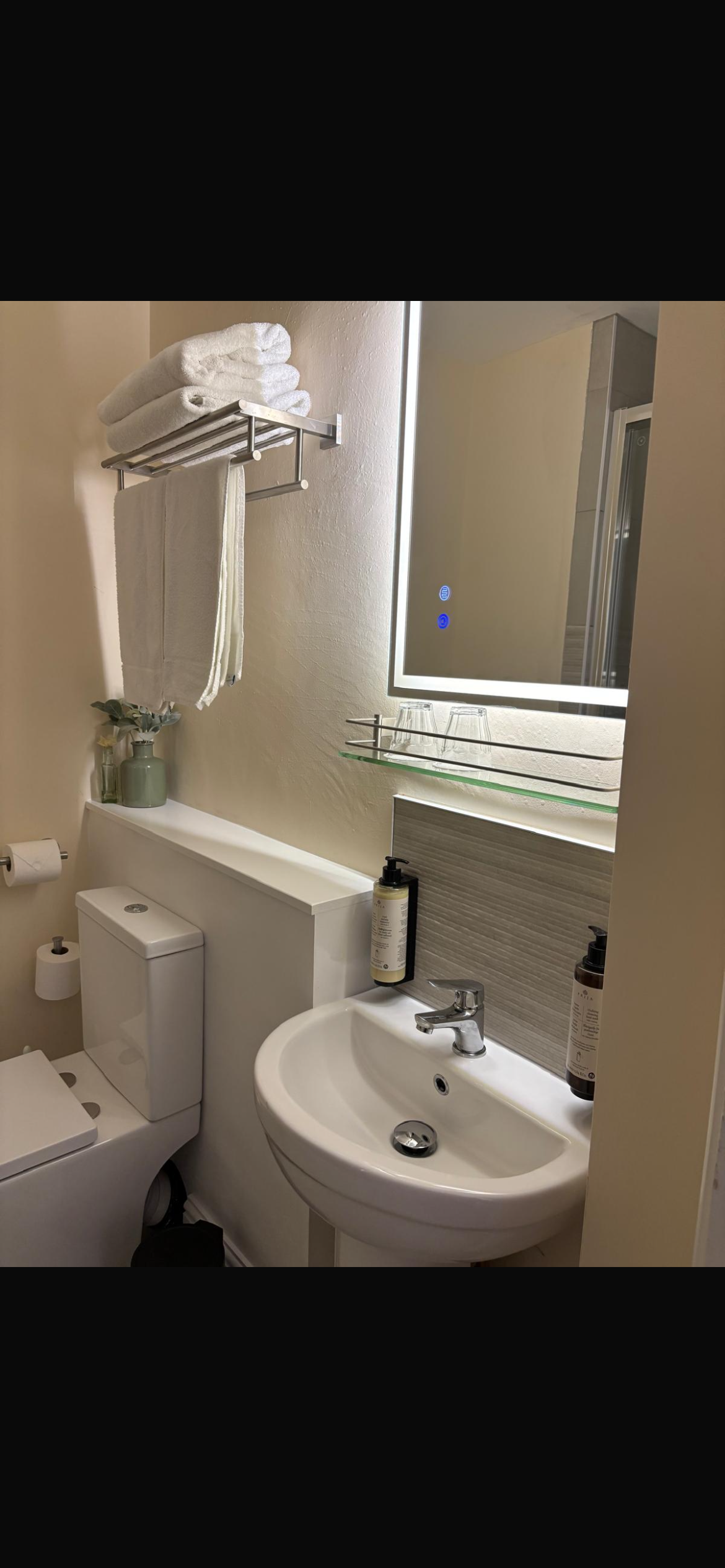 Chapel Suite — en-suite bathroom with lit mirror, fresh towels and luxury toiletries