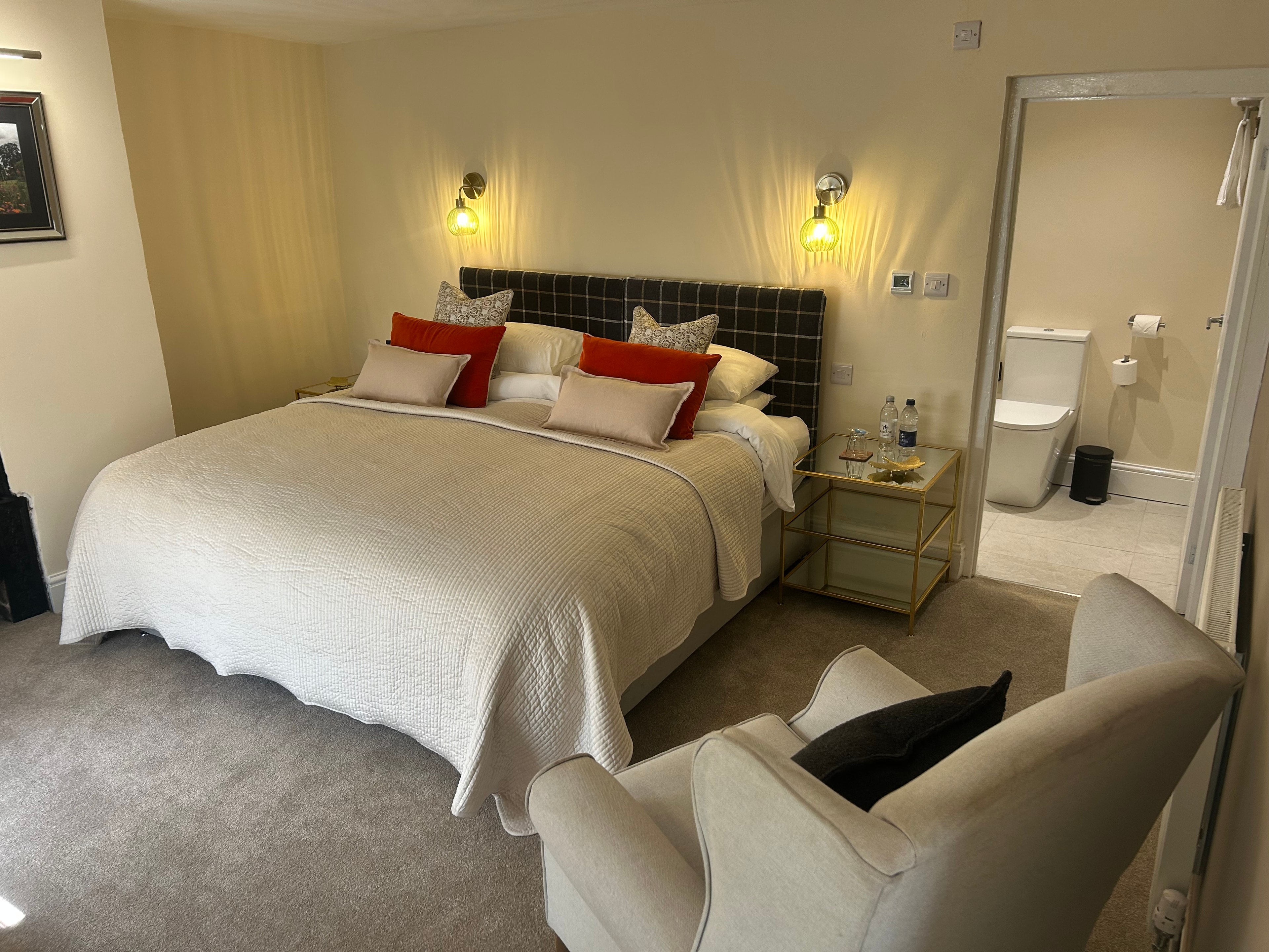Chapel Suite — bedroom with dressing table, tea tray and tartan headboard